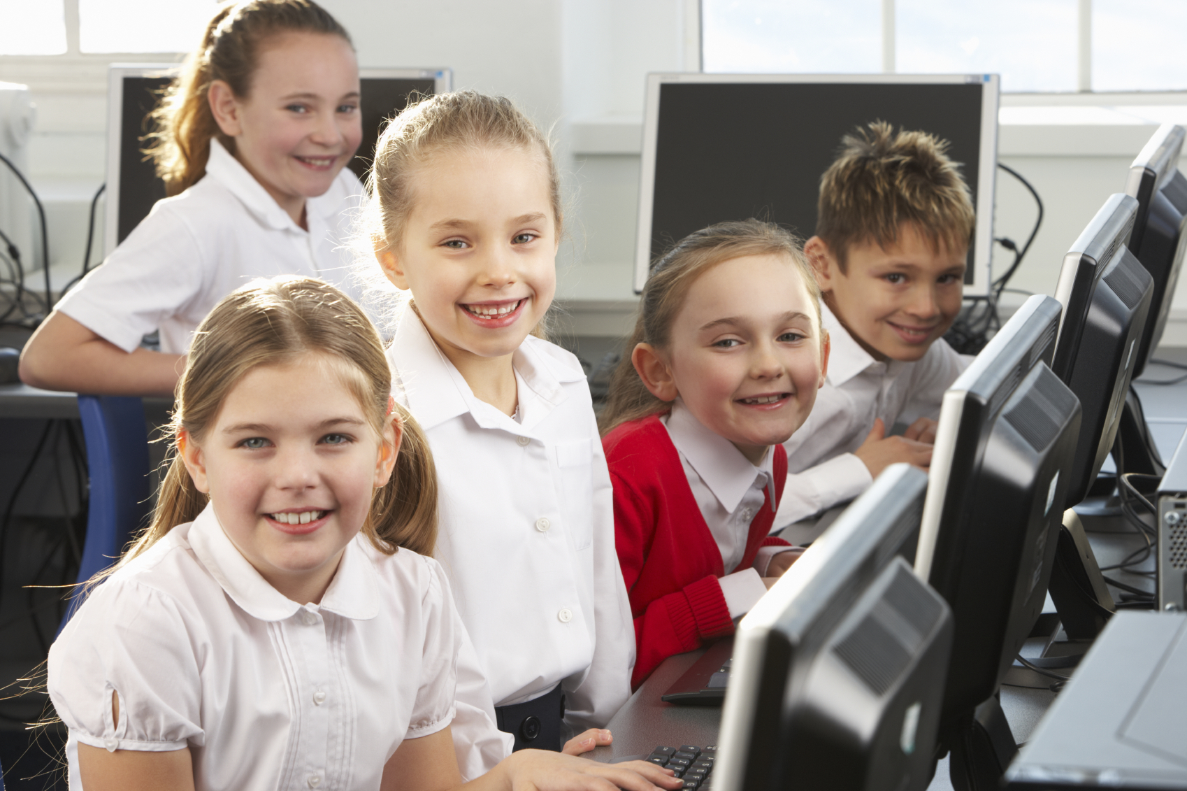 Children using computers in school class